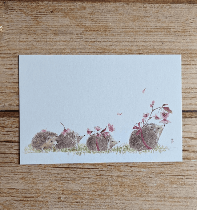 Famille hérisson et fleurs de cerisier 
